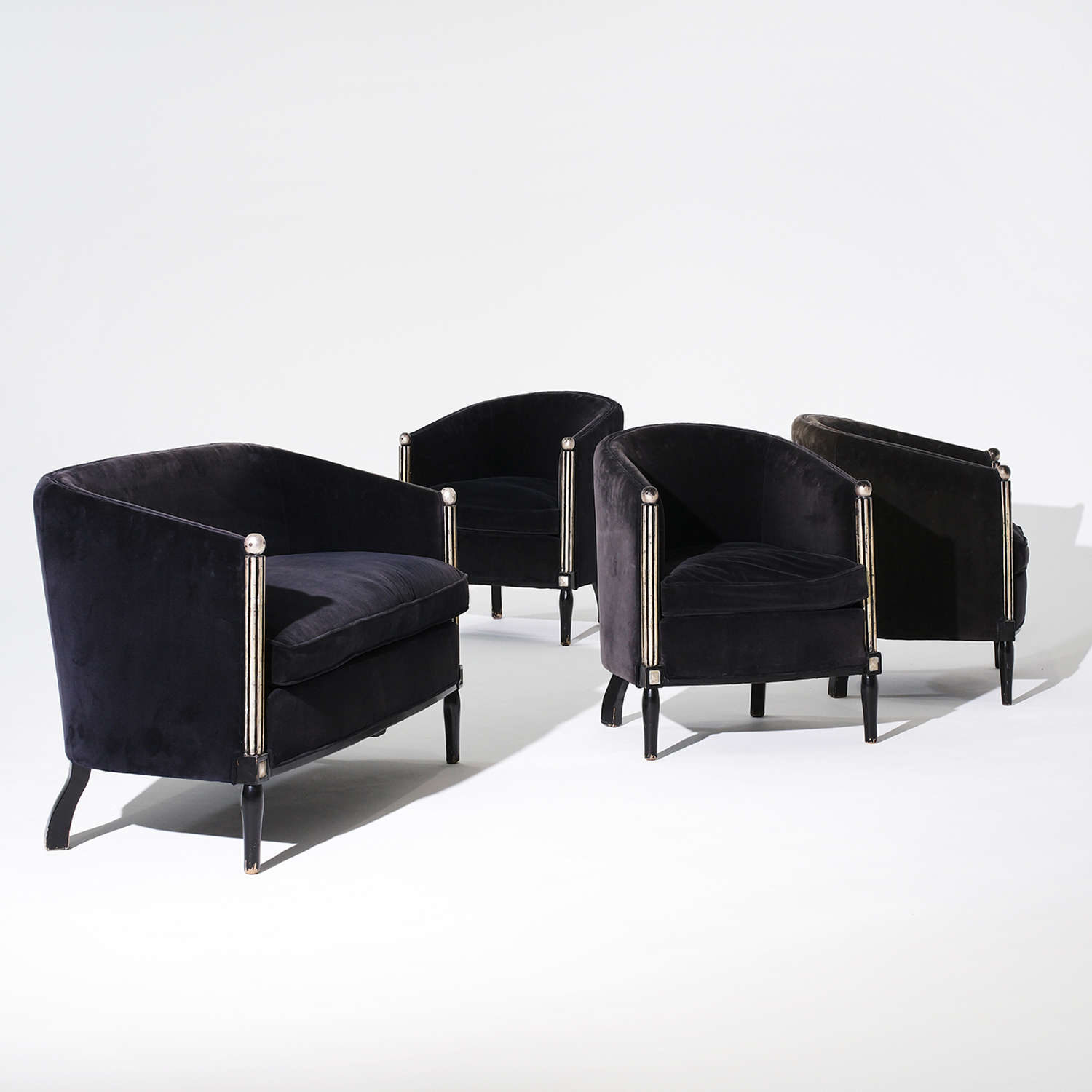 A vintage set of three French Art Deco chairs and sofa upholstered in a black velvet fabric. Circa 1930, Paris, France.